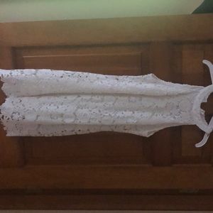 Light lace dress. Form fitting but not tight.